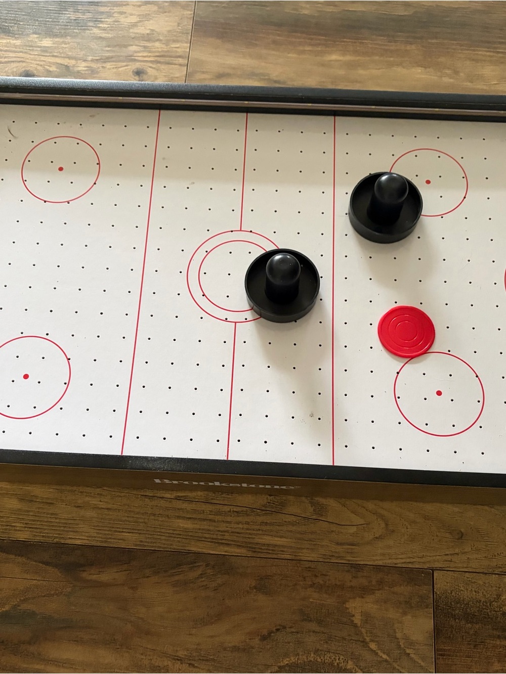 Brookstone White Air Hockey Tabletop with Black Strikers and Red Puck